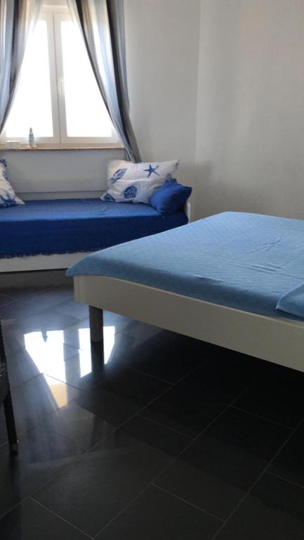 Postel nebo postele na pokoji v ubytování Beach House Paradiso