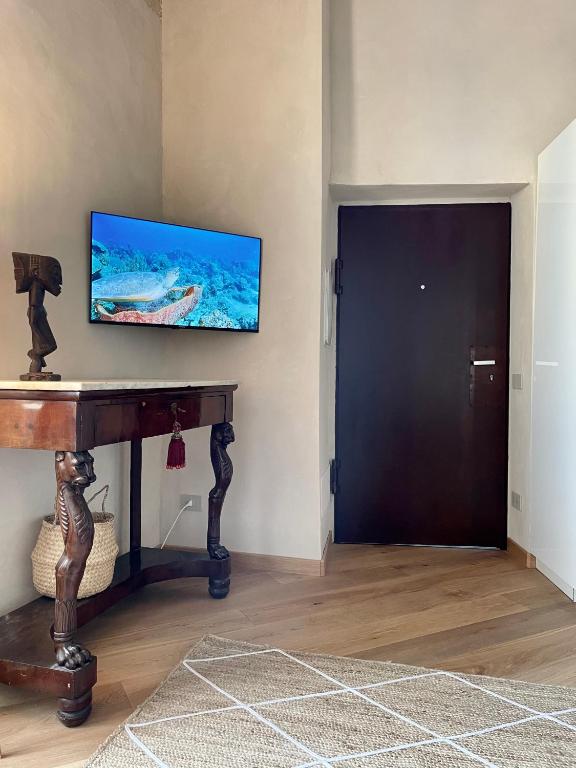 Televízia a/alebo spoločenská miestnosť v ubytovaní Corallini Luxury Apartments - Bokè Apartment