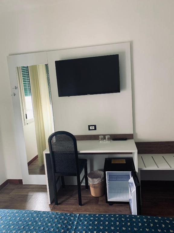 TV a/nebo společenská místnost v ubytování Hotel Al Capitano