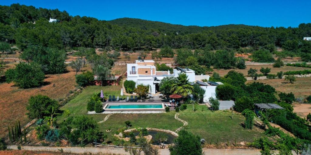 an aerial view of a house with a swimming pool at Finca Can Pepis in Santa Agnès de Corona
