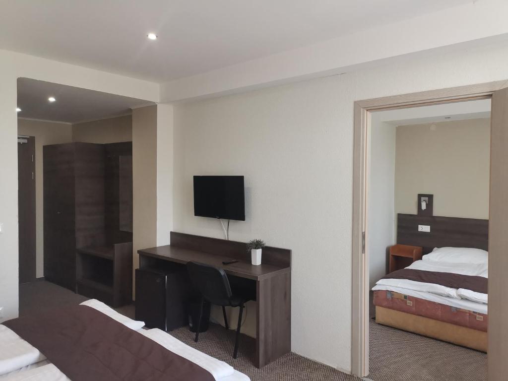Postel nebo postele na pokoji v ubytování Hotel Tagore
