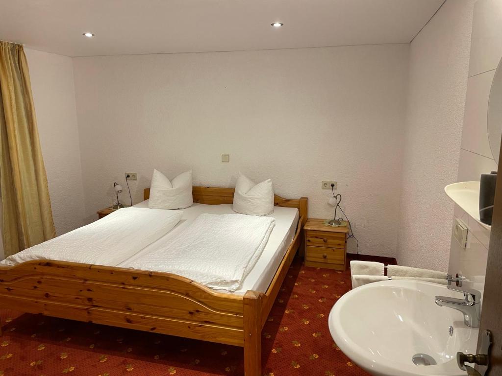 A bed or beds in a room at Haus Resi