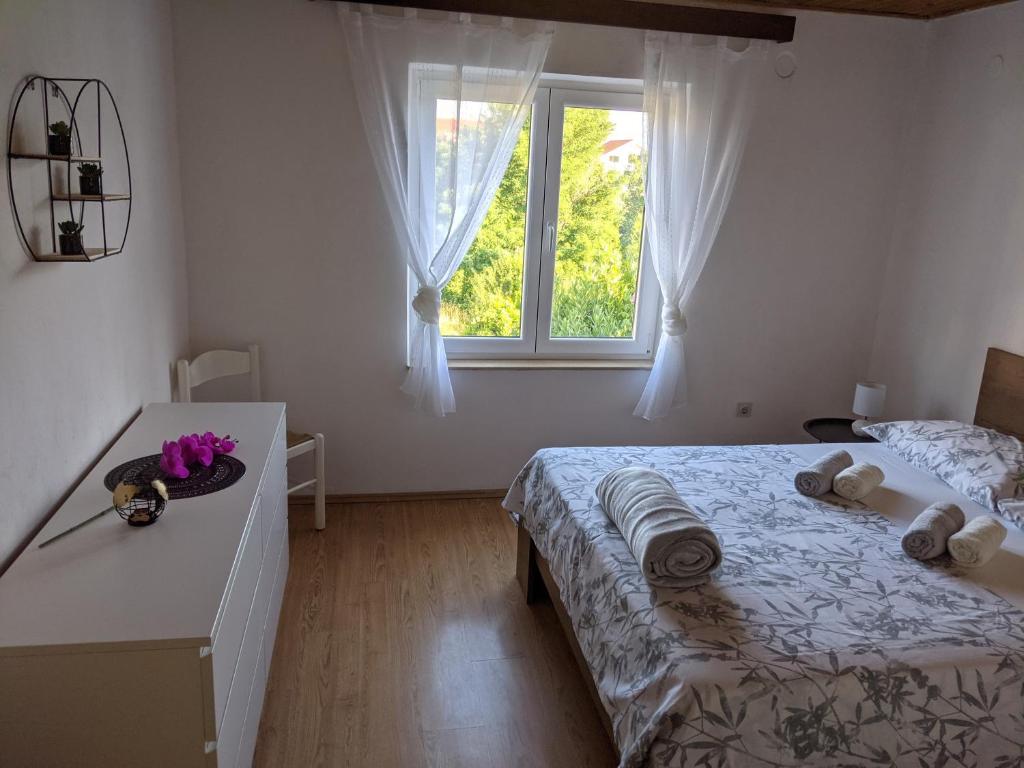 Postel nebo postele na pokoji v ubytování Apartment Fugosic