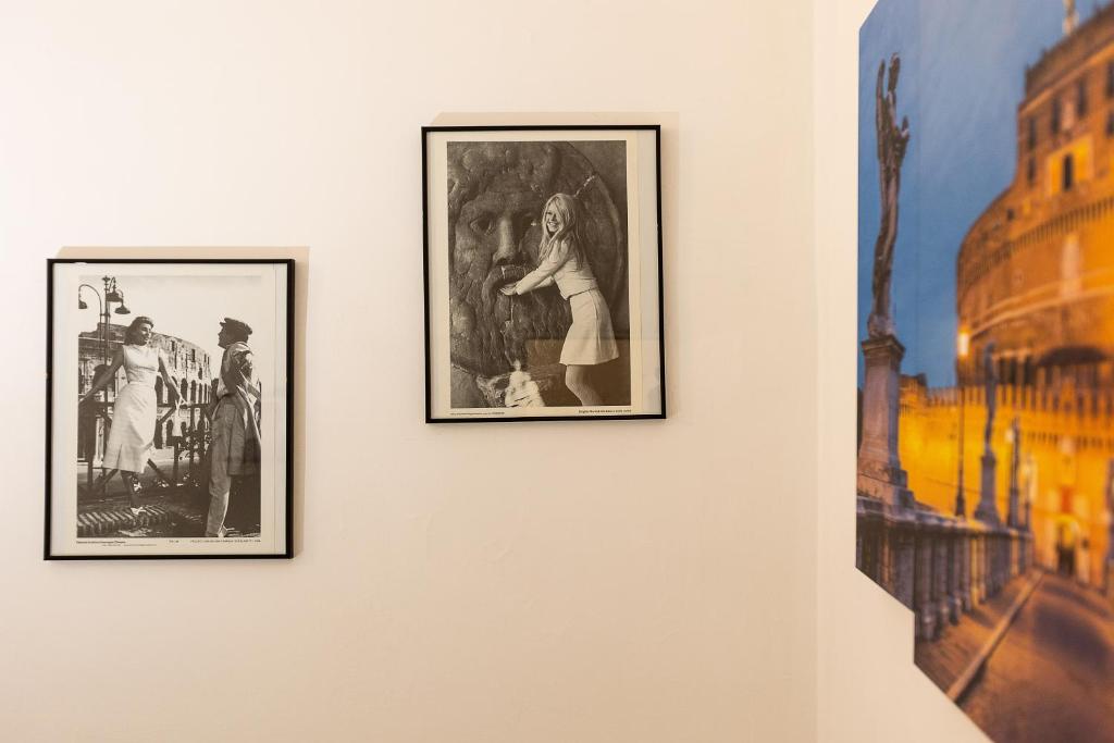 two framed photographs hanging on a wall at Penelope Holiday in Rome