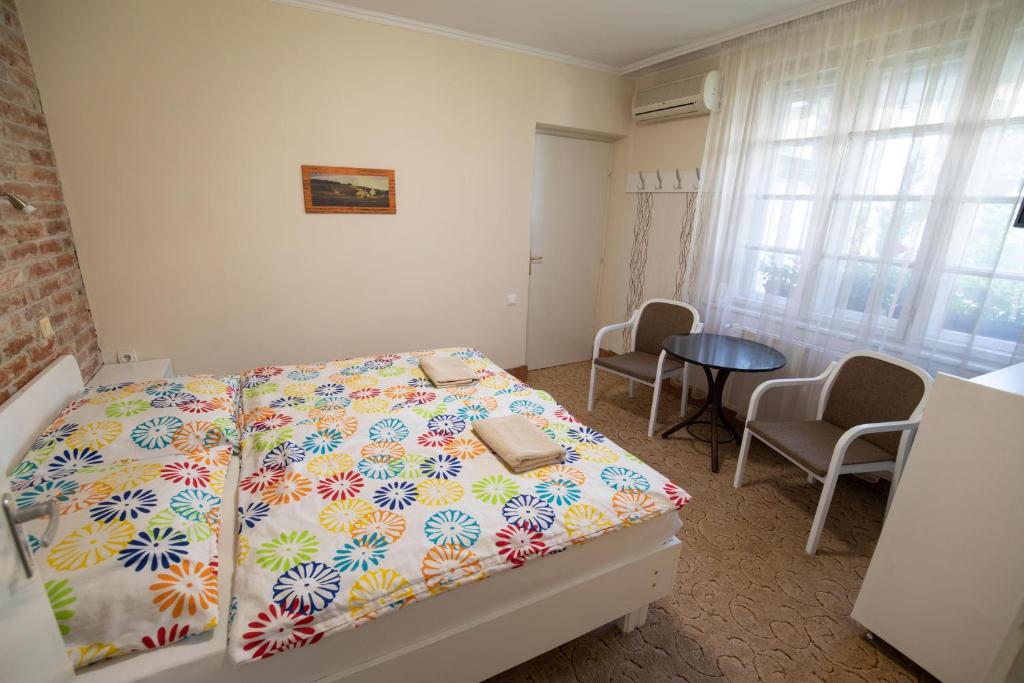 Postel nebo postele na pokoji v ubytování Art Magánszálláshely