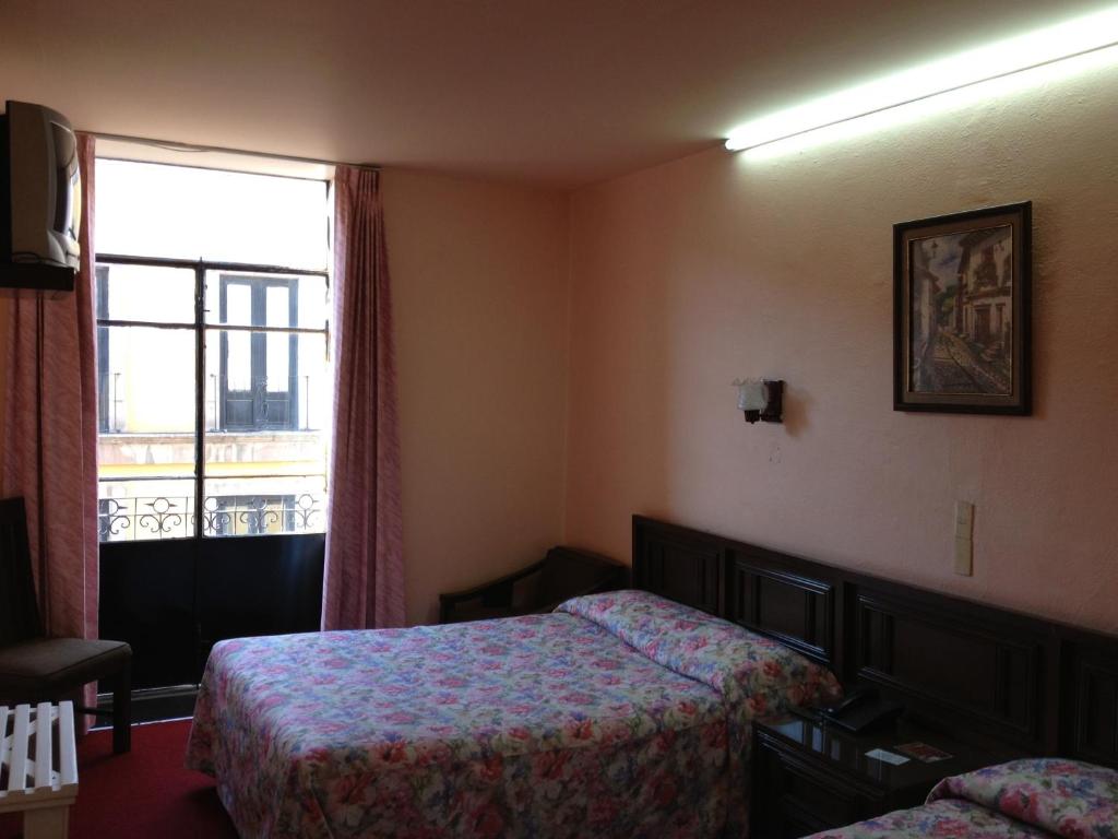 Postel nebo postele na pokoji v ubytování Hotel Gomez de Celaya