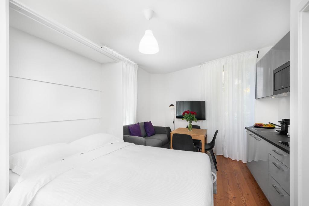 Postel nebo postele na pokoji v ubytování The Studios Montreux - Swiss Hotel Apartments