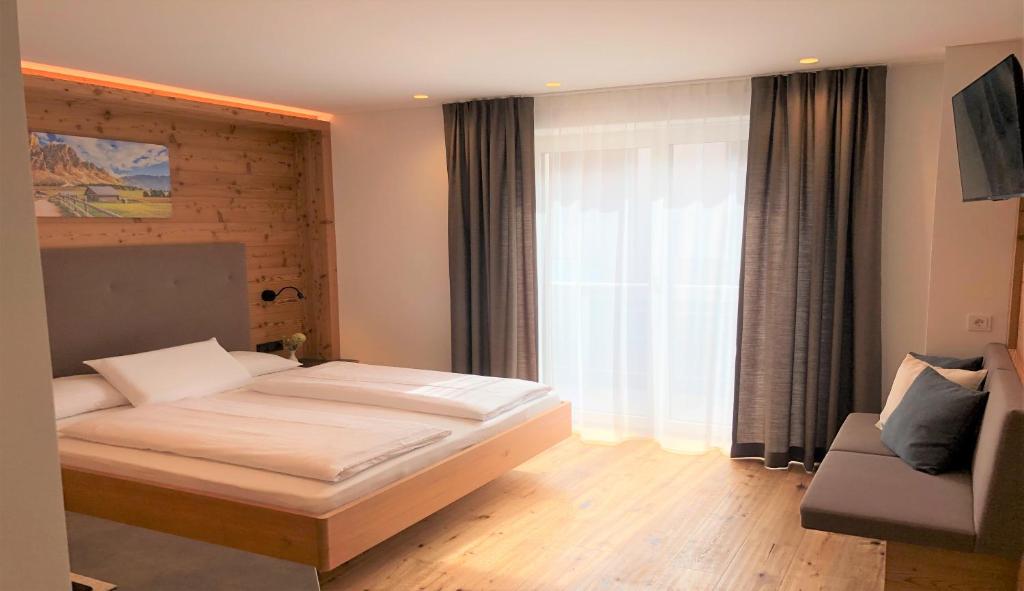 Postel nebo postele na pokoji v ubytování B&B Obermair