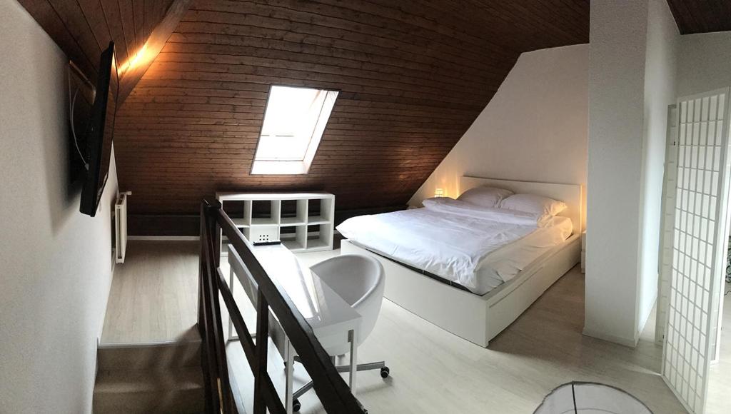 Postel nebo postele na pokoji v ubytování Residence Vue Chateau