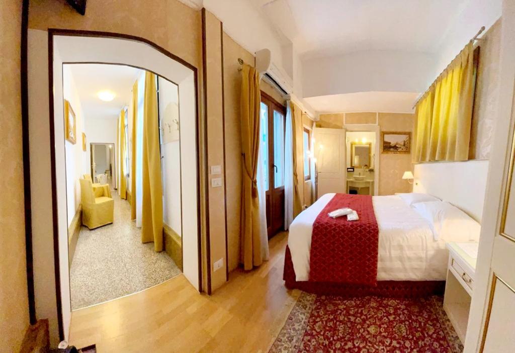 Postel nebo postele na pokoji v ubytování Hotel Corte dei Greci