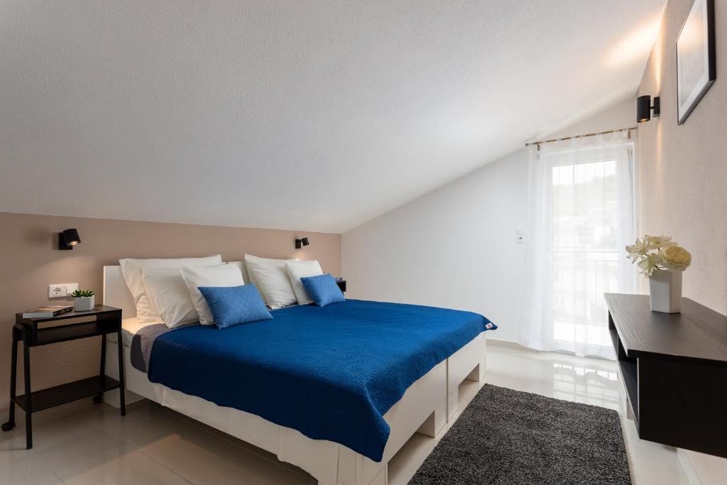 Postel nebo postele na pokoji v ubytování Apartments Iris