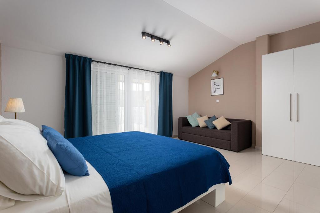 Postel nebo postele na pokoji v ubytování Apartments Iris