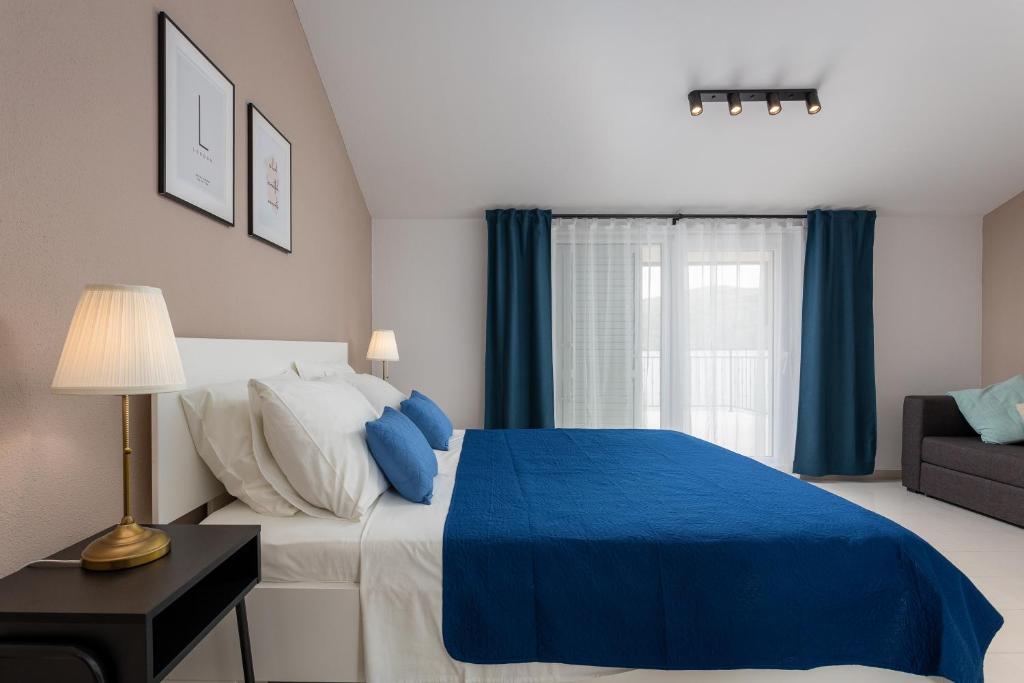 Postel nebo postele na pokoji v ubytování Apartments Iris