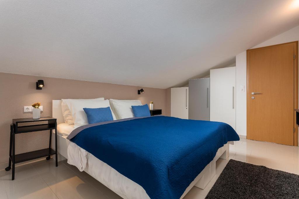 Postel nebo postele na pokoji v ubytování Apartments Iris