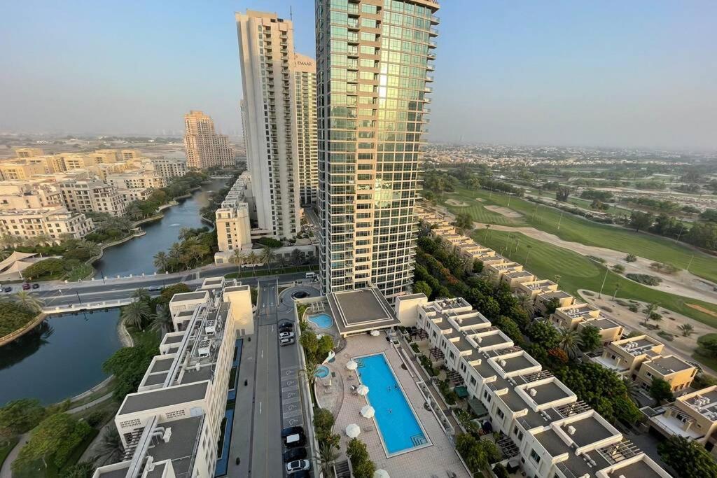 an aerial view of a city with a river and buildings at Quiet and cozy 2 BR apartment with stunning views in Dubai
