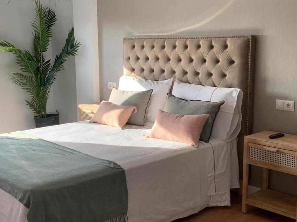 Posteľ alebo postele v izbe v ubytovaní MILLADOIRO BELLA BOUTIQUE
