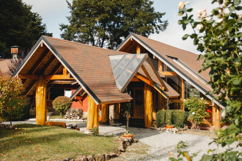 a house with a solar panel on the roof at Peninsula Petit in San Carlos de Bariloche