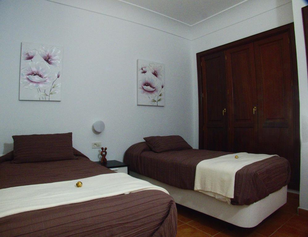Postel nebo postele na pokoji v ubytování Villa Raima