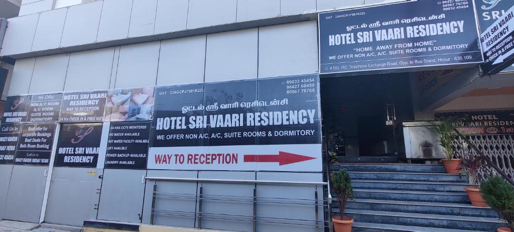 a building with signs on the side of it at HOTEL SRI VAARI RESIDENCY in Hosūr