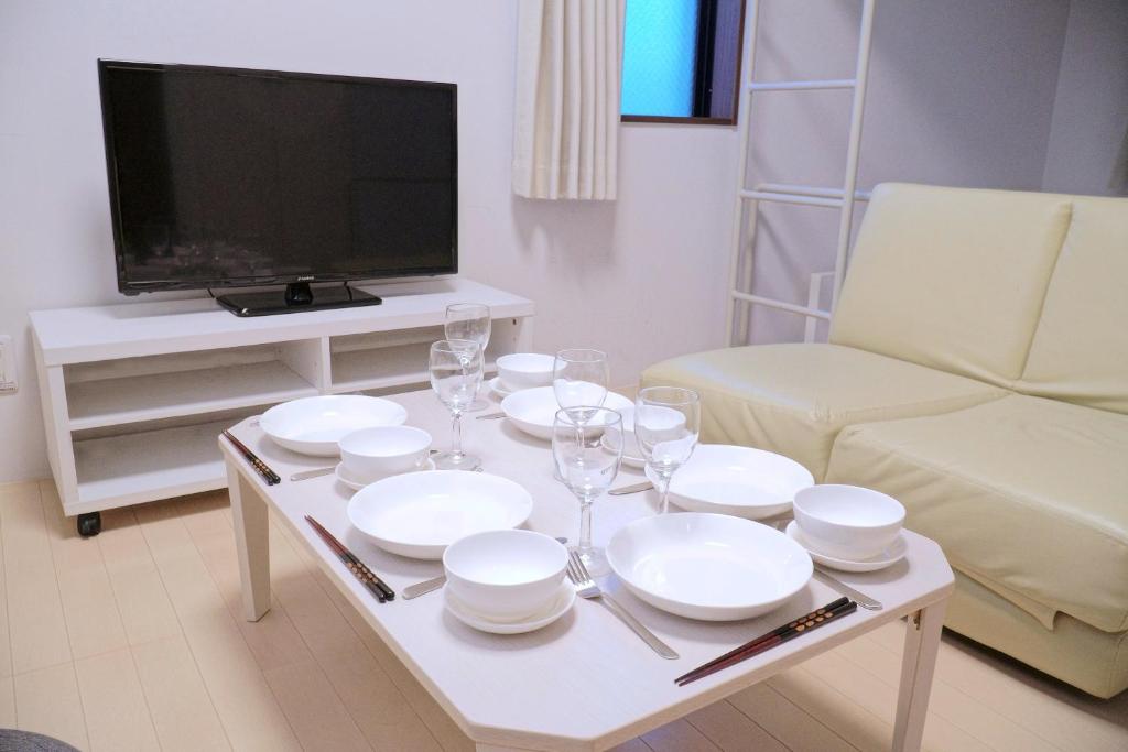 TV a/nebo společenská místnost v ubytování Laffitte Tokyo