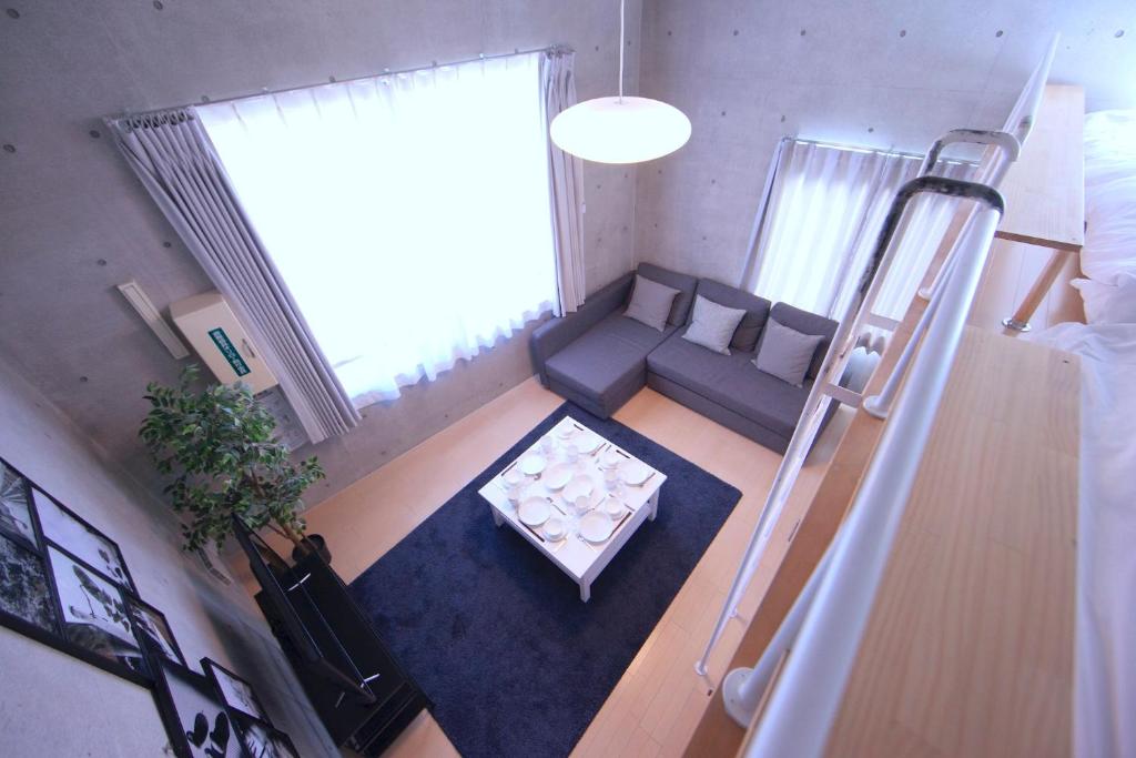 Postel nebo postele na pokoji v ubytování Laffitte Tokyo