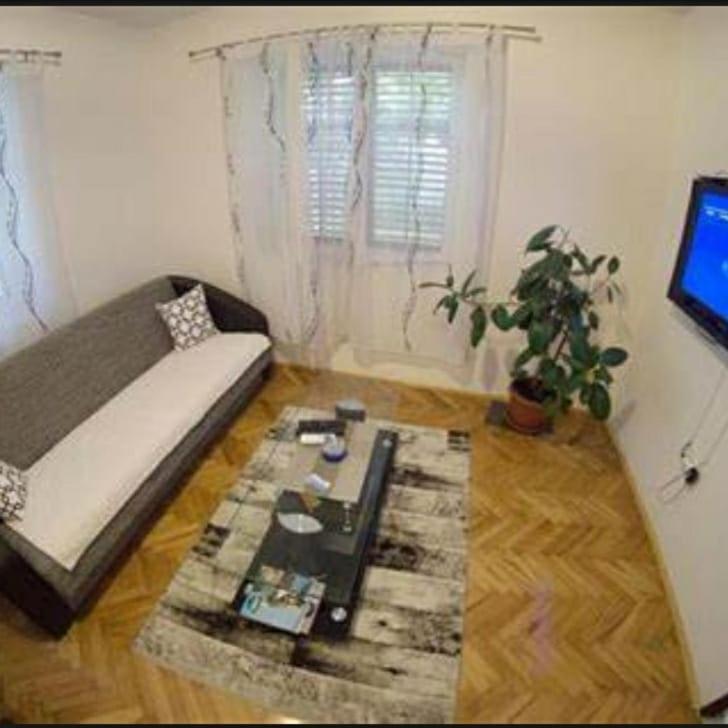 a living room with a couch and a table at Apartmani Miro Trebinje in Trebinje