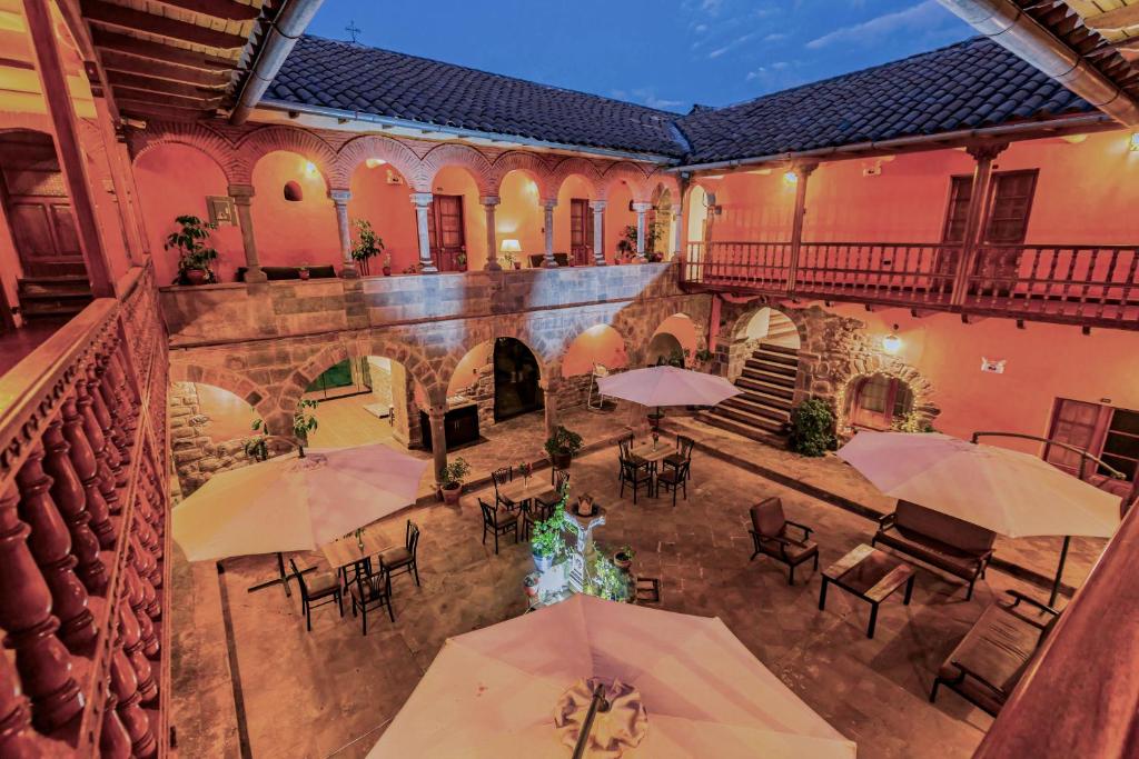 En restaurant eller et andet spisested på Hotel Hacienda Sonqori Centro Histórico