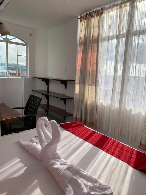 Postel nebo postele na pokoji v ubytování Hotel La Barca