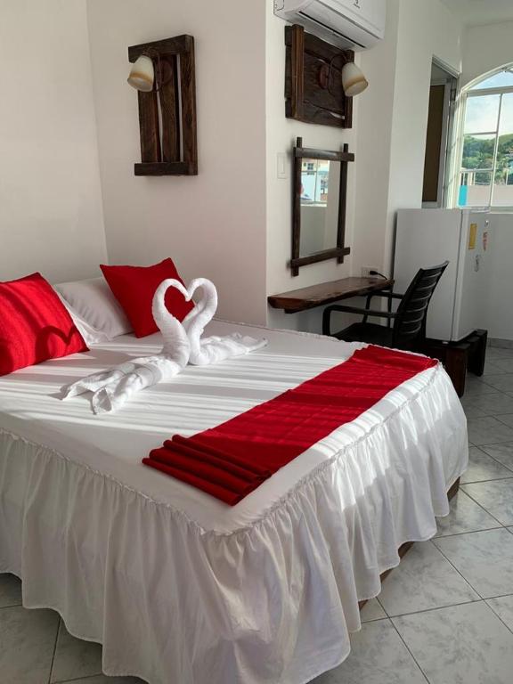 Postel nebo postele na pokoji v ubytování Hotel La Barca
