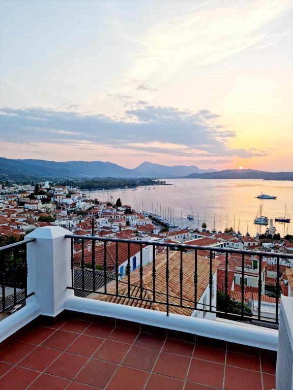 a view of a harbor from a balcony at Panoramic View in Poros