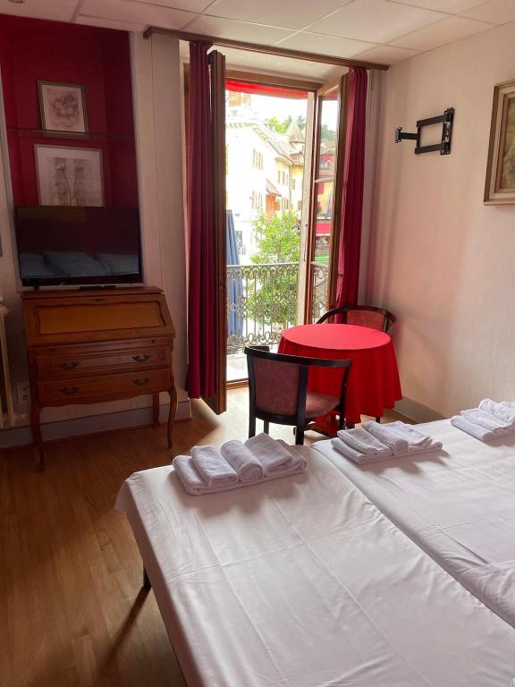 Cama o camas de una habitación en Hotel de Savoie