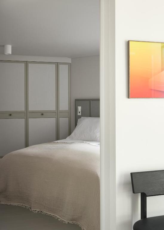 Letto o letti in una camera di Boutique Hotel Benedict Noordwijk