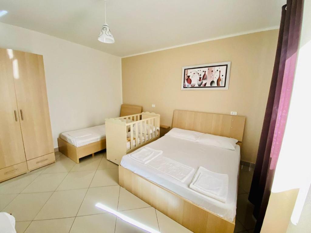 Postel nebo postele na pokoji v ubytování Vila Hotel