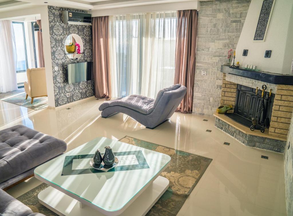 a living room with a couch and a table at Golden Apartments in Ulcinj