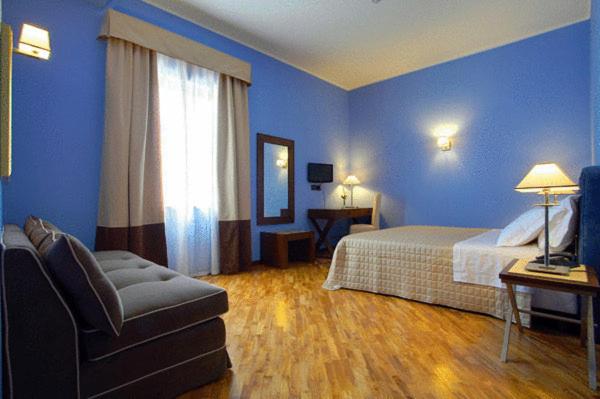 Postel nebo postele na pokoji v ubytování Hotel Messenion
