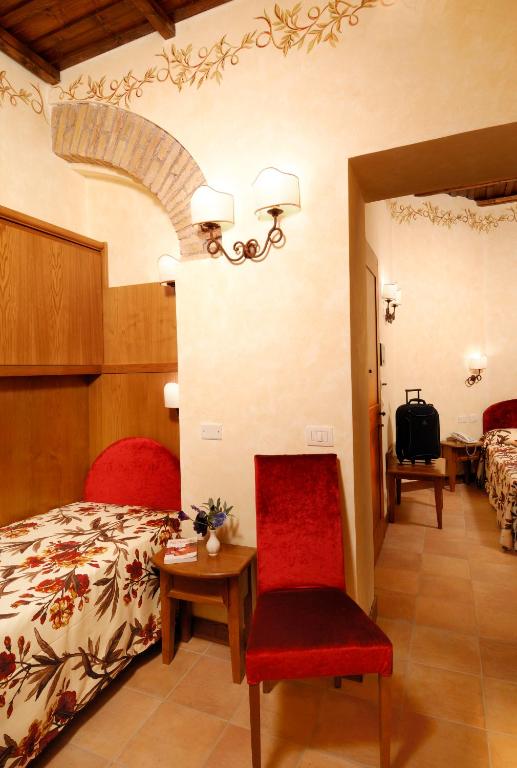 Łóżko lub łóżka w pokoju w obiekcie Residenza San Calisto