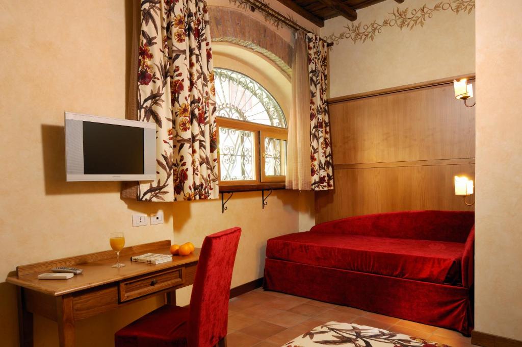 Telewizja i/lub zestaw kina domowego w obiekcie Residenza San Calisto