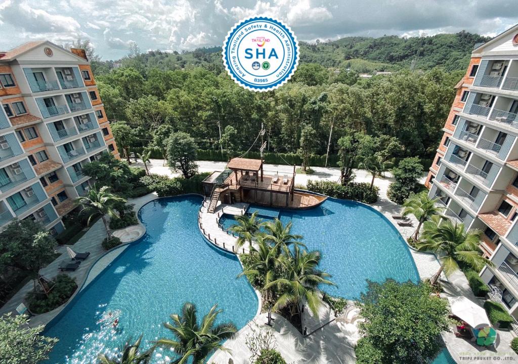 an image of a swimming pool at a resort at The Title Residencies Naiyang By Trips Phuket - SHA Certified in Nai Yang Beach