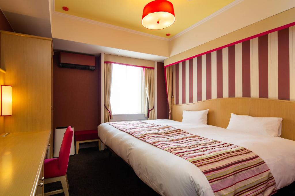 Postel nebo postele na pokoji v ubytování Hotel Monterey Kyoto
