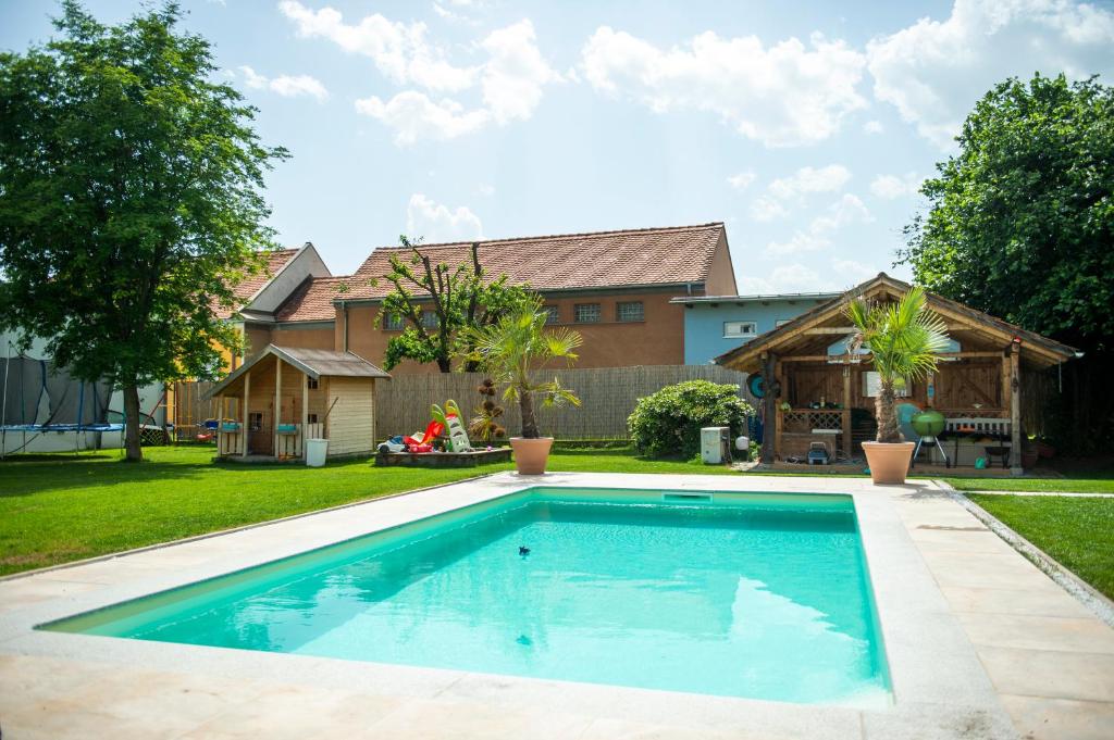 a swimming pool in the yard of a house at Murtal Suiten in Zeltweg