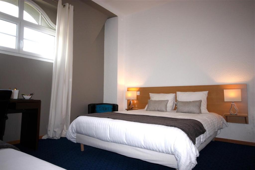 Postel nebo postele na pokoji v ubytování Hôtel la Régie