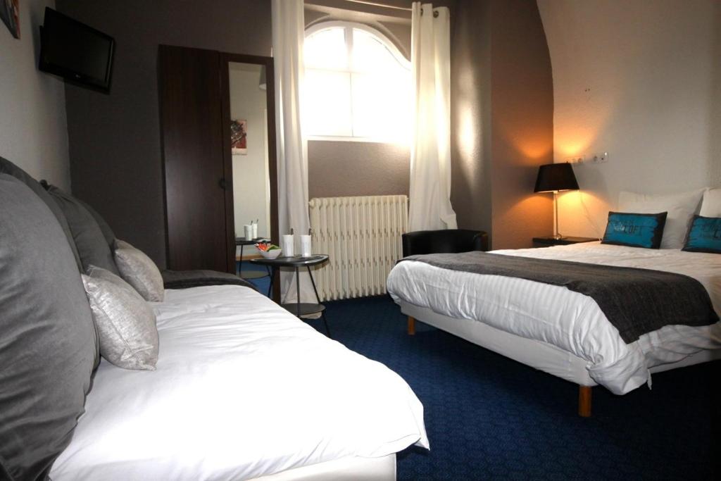 Postel nebo postele na pokoji v ubytování Hôtel la Régie