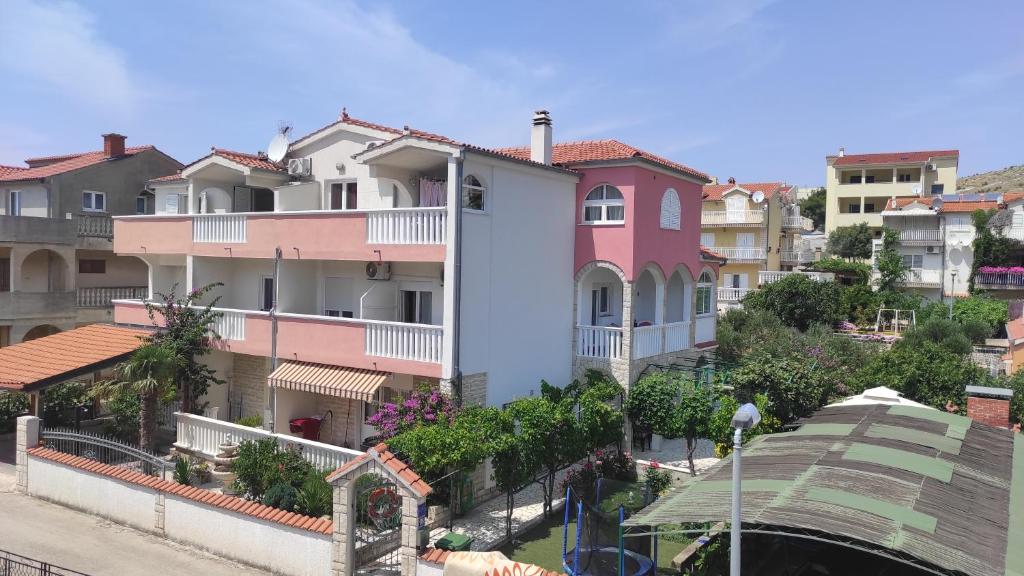 a group of houses on a city street at Ivano Apartments in Grebaštica