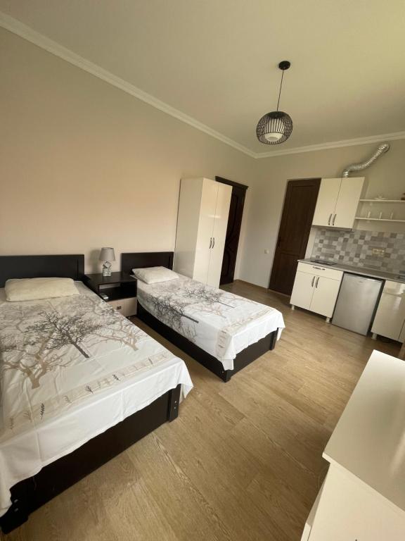 Postel nebo postele na pokoji v ubytování Guest House Kobuleti