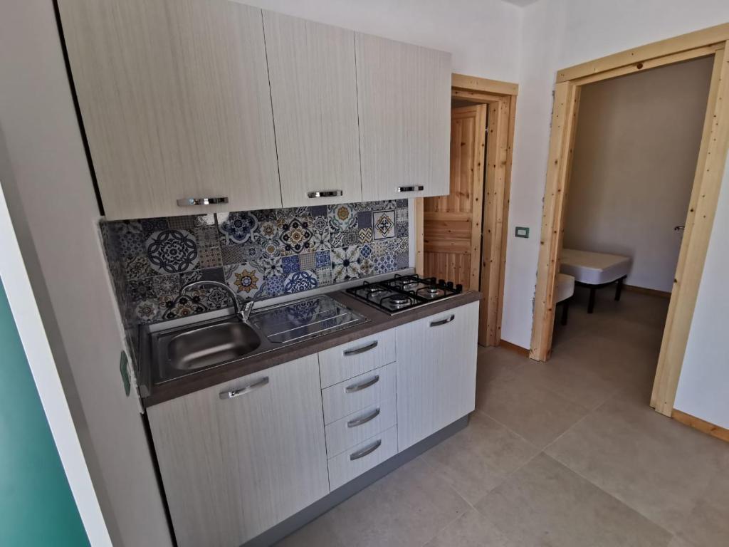 Kuchyň nebo kuchyňský kout v ubytování Villaggio Camping Uria