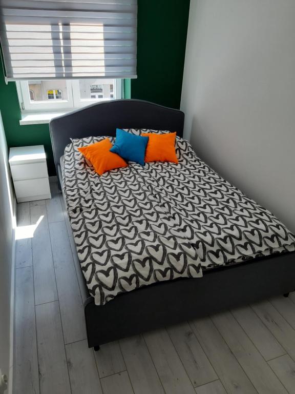 Posteľ alebo postele v izbe v ubytovaní Apartamenty Katowice Stawowa 5
