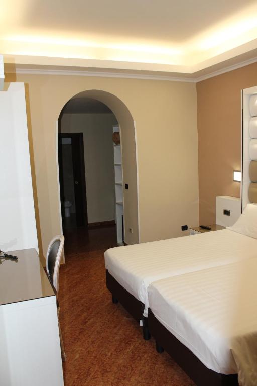 Postel nebo postele na pokoji v ubytování Hotel San Marco