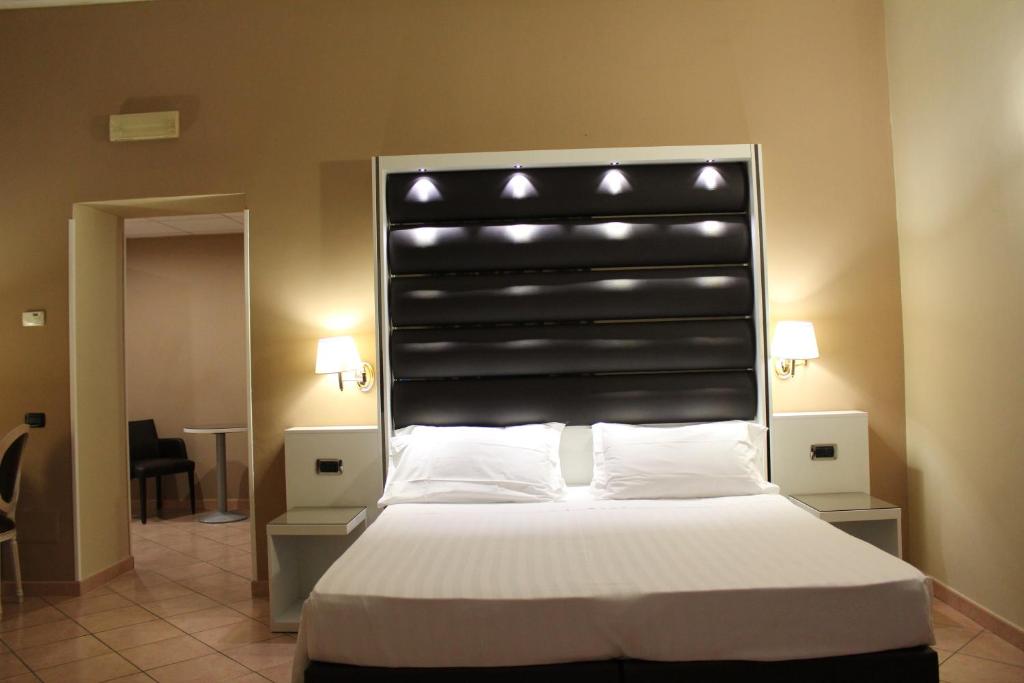 Postel nebo postele na pokoji v ubytování Hotel San Marco