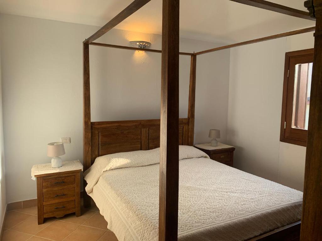 Postel nebo postele na pokoji v ubytování APPARTAMENTI BELLA VISTA SU TAVOLARA