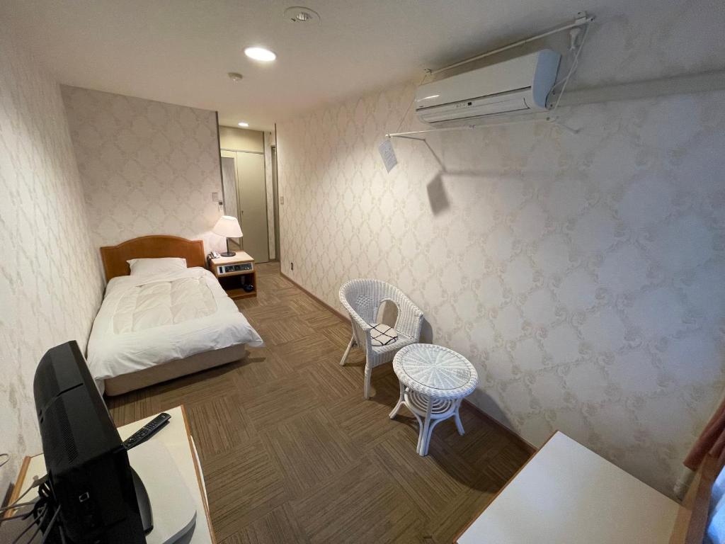 Postel nebo postele na pokoji v ubytování Hotel Ginsui